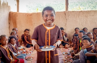 Happy children eating, Madagascar