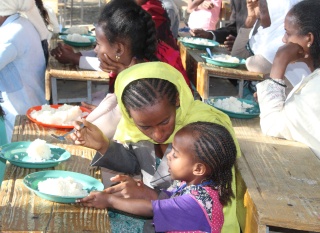 An Ethiopian mother feeds her child Marys Meals