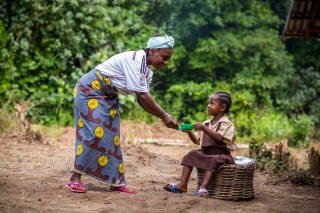 Cook serving Marys Meals in Liberia