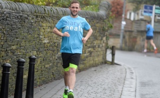 Man wearing Mary's Meals t-shirt running