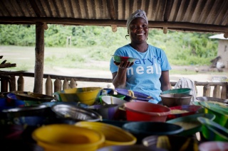 Mary's Meals volunteer preparing food in kitchen