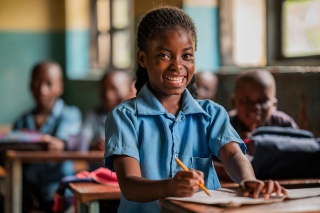 An image of a child learning in class