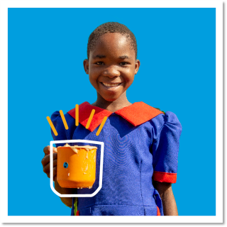 Blue background, smiling girl holding orange mug with annotation drawn around the mug
