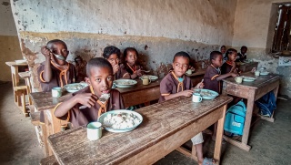 Children in a school in Madagascar eating Mary's Meals