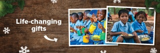 Images of happy children sit on a festive wooden background with snowflakes and Christmas tree branches while text reads 'life changing gifts'