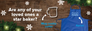 Blue Mary's Meals apron and mug shaped cookie cutter sits on a festive wooden background with snowflakes and Christmas tree branches with the text 'Are any of your loved ones a star baker?'