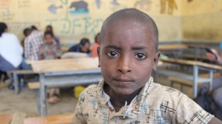 A boy in a classroom in Ethiopia