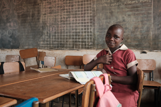 Image of a child in a classroom in Zimbabwe