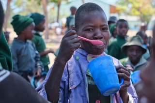 A child eating their school meal