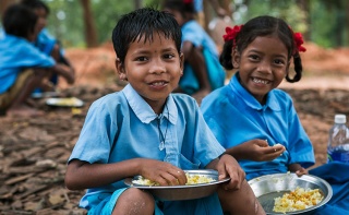 Image of children holding their school meal