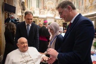 Magnus MacFarlane-Barrow shaking hands with Pope Francis